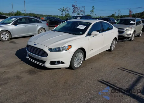 2013 Ford Fusion Hybrid Se z USA, uszkodzony, nr VIN 3FA6P0LUXDR318532